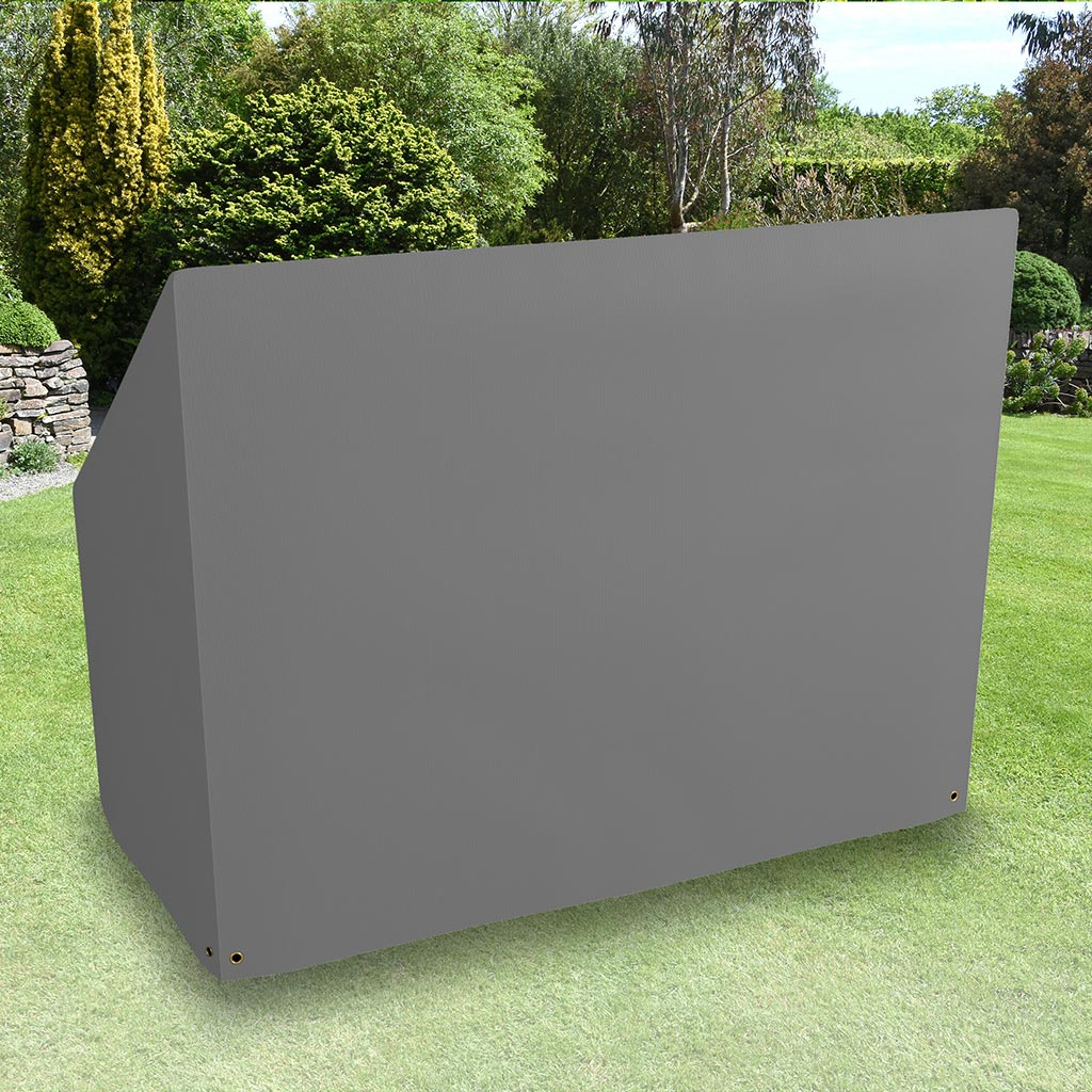 All-weather Hammock Cover placed in a garden on grass with plants behind 
