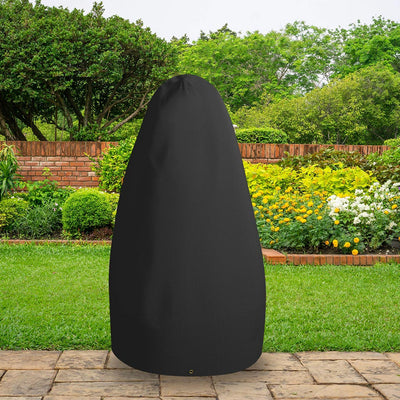 All-weather Double Hanging Chair Cover - Black - placed in a garden on grass with plants behind 