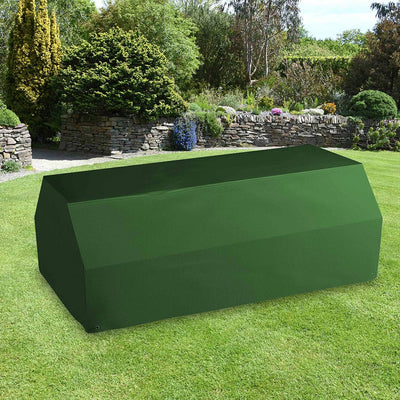 All-weather Picnic Table & Bench Cover placed in a garden on grass with plants behind