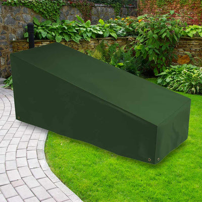 Protector 6000 Sun Lounger Cover - Dark Green- placed on grass with plants in the background